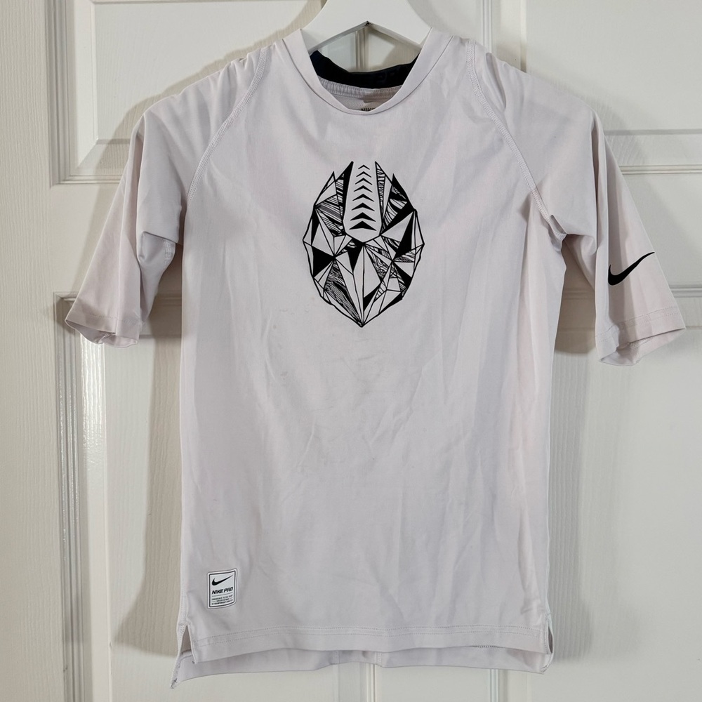Nike Pro Performance Football Graphic Training Shirt in White and Black.